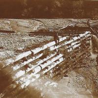 Debris dam built to contain sediments from hydraulic mining