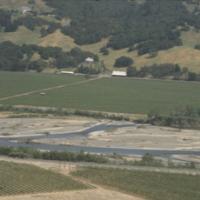 Expansion of agriculture into valleys and onto hillsides, replacing riparian corridors on many streams and areas of the river;